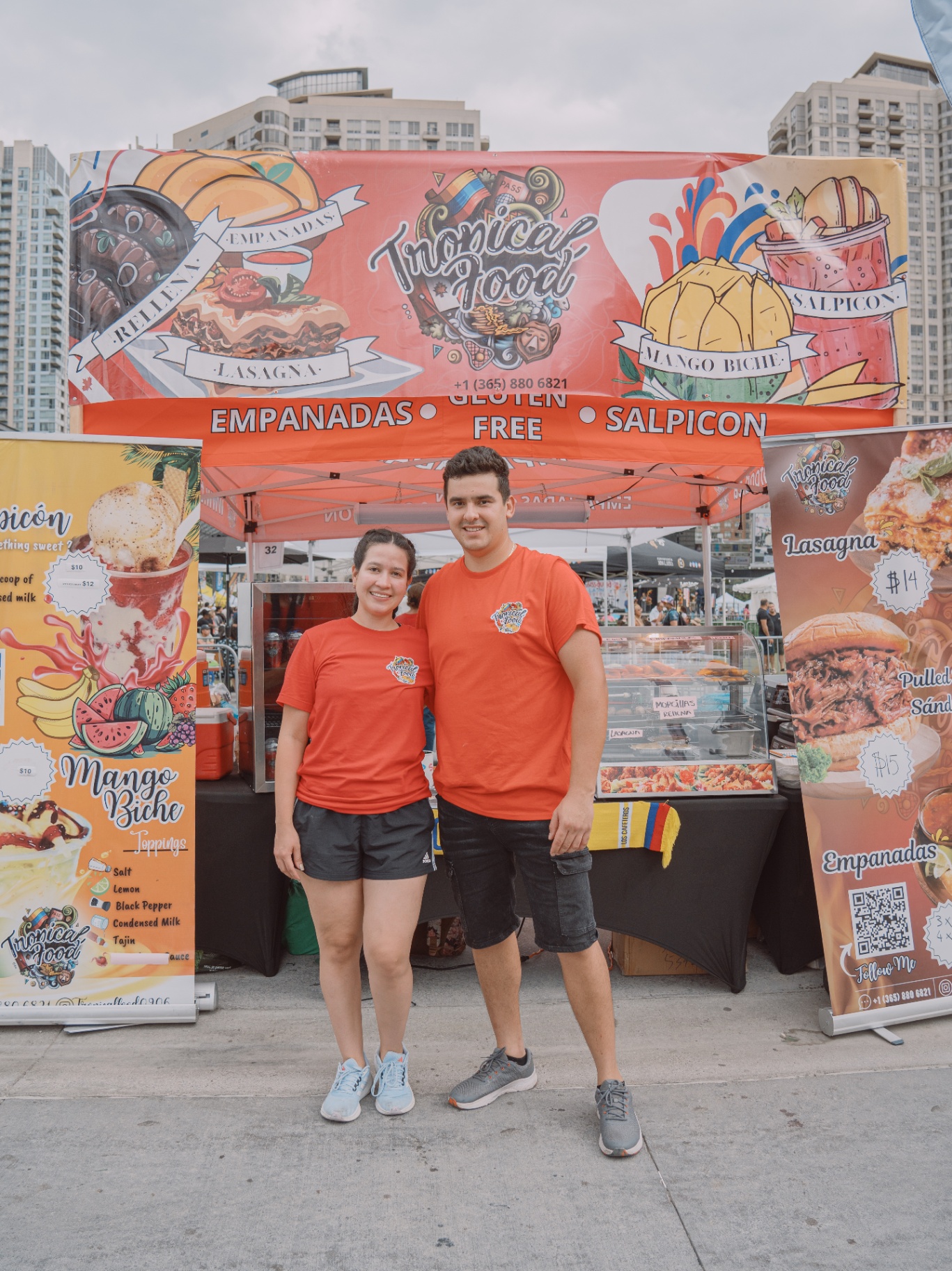 Tropical Food team serving Colombian empanadas at a community event in Toronto